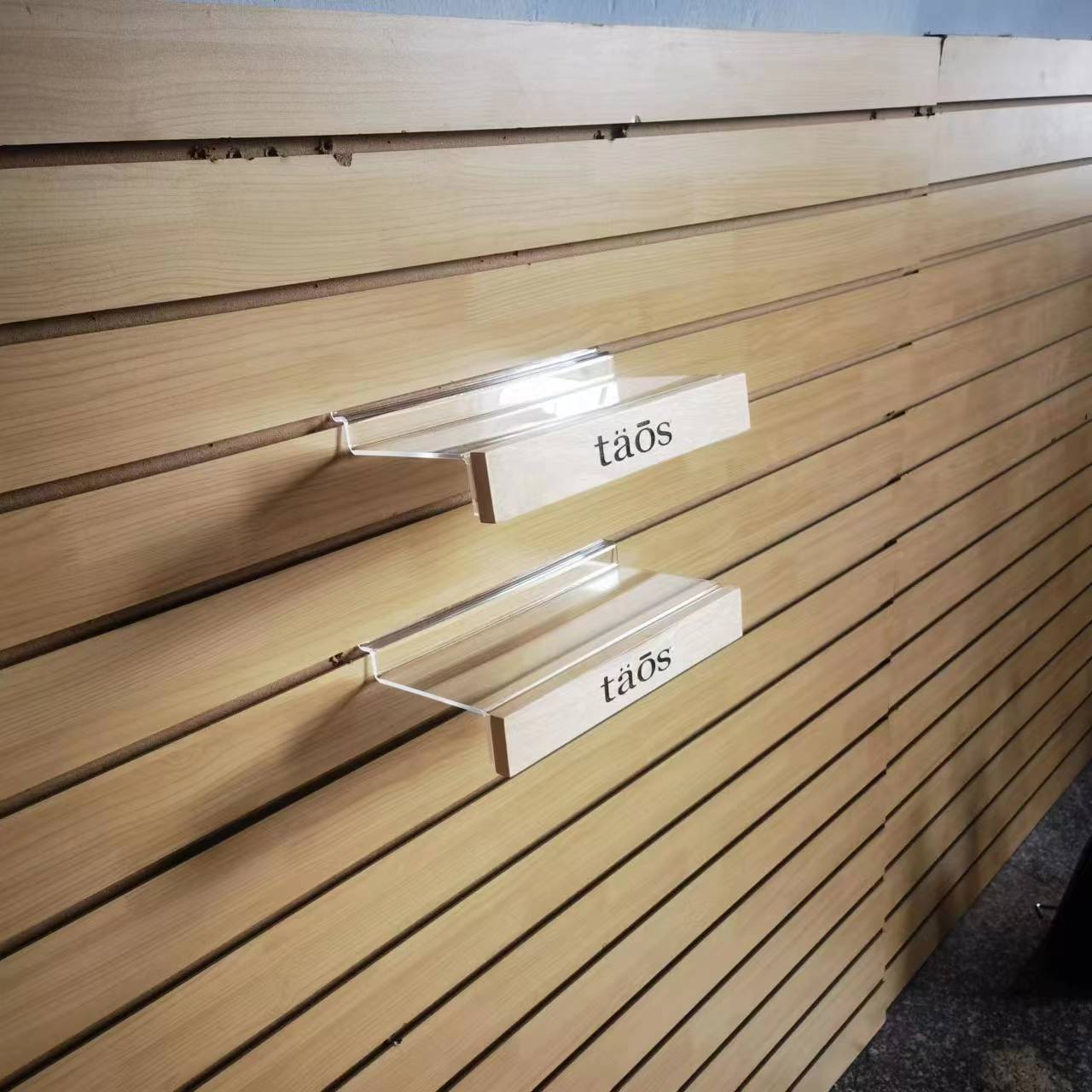 Plastic and wood slatwall shoe shelf with logo