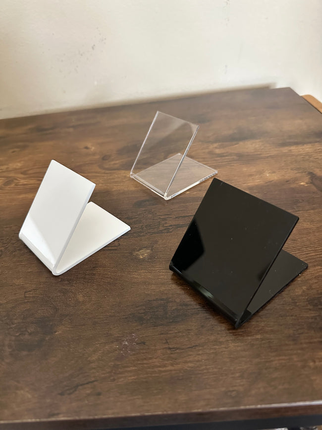 Mini shoe risers in white or black or clear plastic